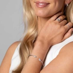 Chisholm Hunter 18ct White Gold Pear Emerald & Brilliant Cut 1.08ct Diamond Crossover Bangle 23 Chisholm Hunter 18ct White Gold Pear Emerald & Brilliant Cut 1.08ct Diamond Crossover Bangle -Chisholm Hunter 15 123 01 0047 om c 2