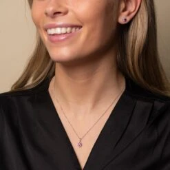 Chisholm Hunter 9ct White Gold 0.10ct Diamond And Ruby Halo Earrings -Chisholm Hunter 16 126 05 0025 and 16 126 01 0044 lifestyle set