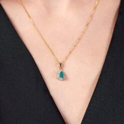 Chisholm Hunter 9ct Yellow Gold Pear Cut Emerald And 0.04ct Diamond Halo Pendant -Chisholm Hunter 16 127 02 0010 om 1